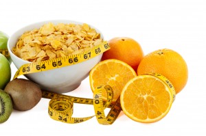 cereals and fruits with measuring tape